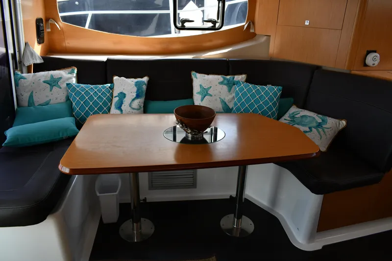 Beach Cat Yacht Photos Pics Interior of 2012 Fountaine Pajot 40 catamaran with cozy seating and decorative pillows.