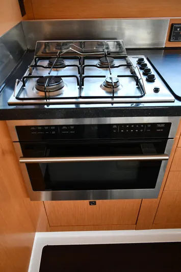 Beach Cat Yacht Photos Pics Modern kitchen stove and oven in 2012 Fountaine Pajot 40 yacht galley.