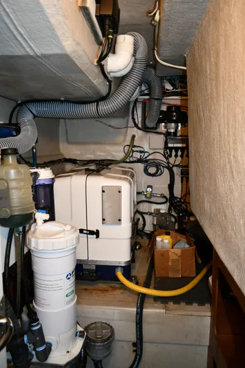 Beach Cat Yacht Photos Pics Engine room of a 2012 Fountaine Pajot 40 catamaran with various mechanical components.