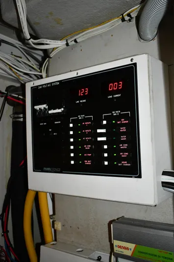 Beach Cat Yacht Photos Pics Electrical panel on a 2012 Fountaine Pajot 40 catamaran, displaying voltage and current readings.