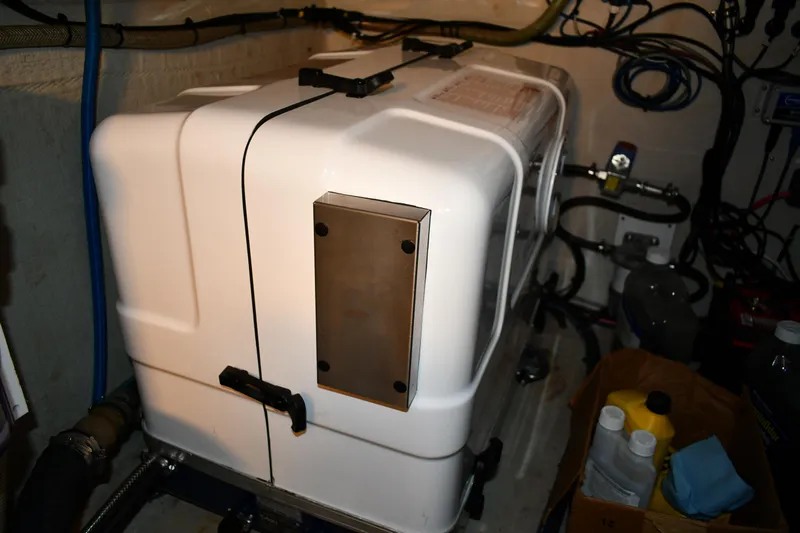 Beach Cat Yacht Photos Pics Engine compartment of 2012 Fountaine Pajot 40 catamaran, featuring machinery and maintenance supplies.