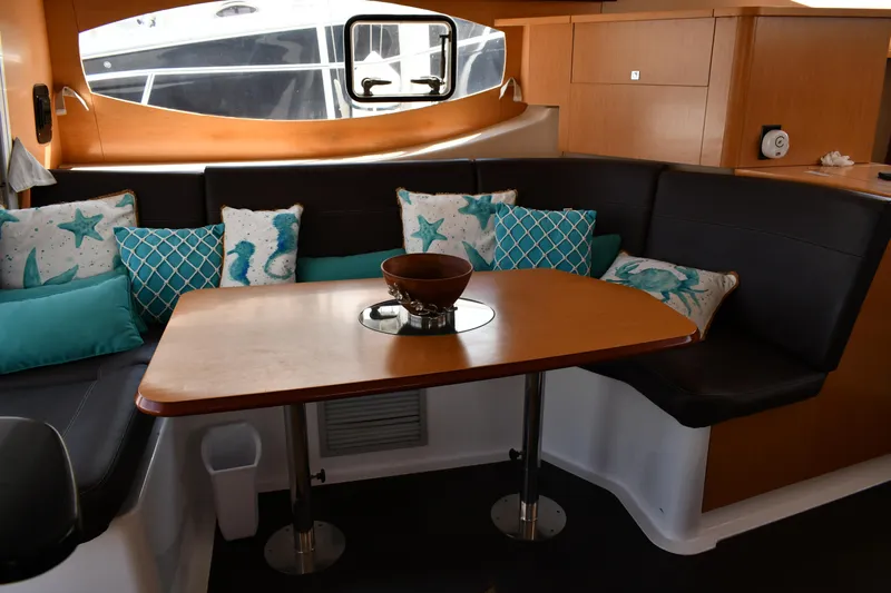 Beach Cat Yacht Photos Pics Cozy interior of 2012 Fountaine Pajot 40 catamaran with stylish seating and decorative pillows.