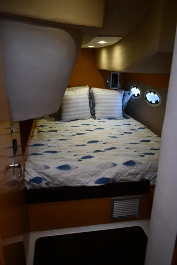 Beach Cat Yacht Photos Pics Cabin interior of 2012 Fountaine Pajot 40 catamaran with cozy bed and porthole windows.