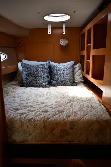 Beach Cat Yacht Photos Pics Cozy cabin interior of 2012 Fountaine Pajot 40 catamaran with bed and decorative pillows.