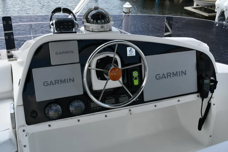 Beach Cat Yacht Photos Pics Helm of 2012 Fountaine Pajot 40 catamaran with Garmin navigation systems and steering wheel.