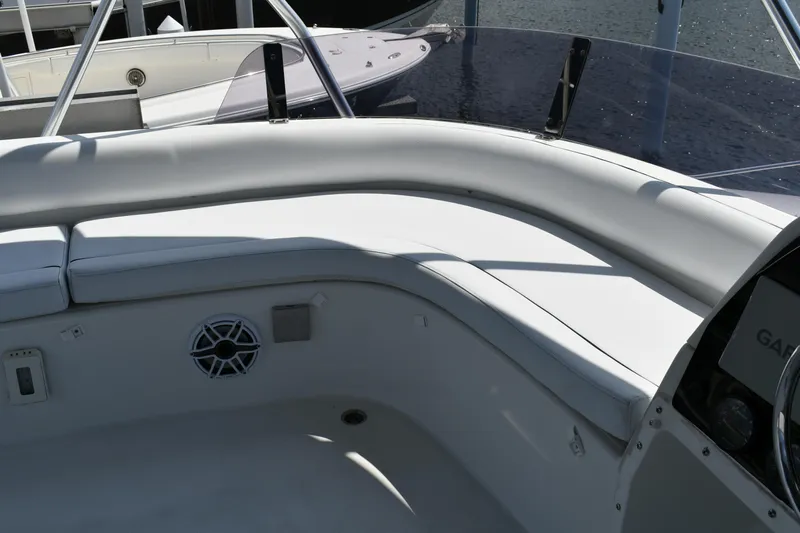 Beach Cat Yacht Photos Pics Interior seating area of a 2012 Fountaine Pajot 40 catamaran, featuring white cushioned seats.