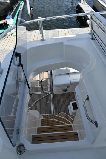 Beach Cat Yacht Photos Pics Staircase on 2012 Fountaine Pajot 40 yacht, leading to deck with wooden flooring.