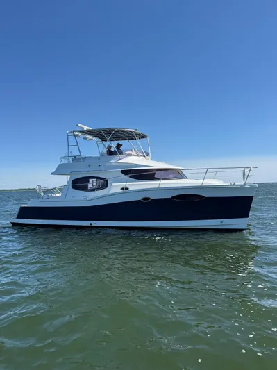 Beach Cat Yacht Photos Pics 2012 Fountaine Pajot 40 catamaran on calm water under clear blue sky.