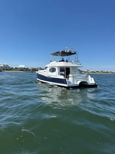 Beach Cat Yacht Photos Pics 2012 Fountaine Pajot 40 catamaran cruising on open water under clear blue skies.