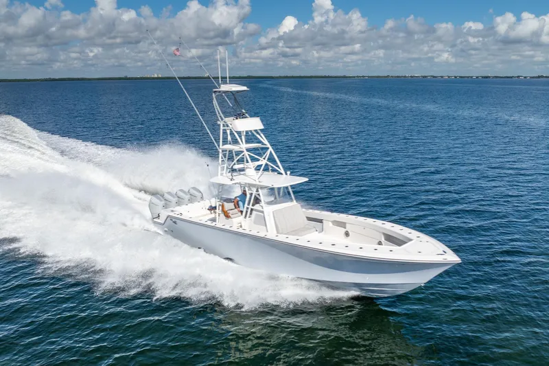  Yacht Photos Pics 2024 SeaVee 400Z boat cruising on open water under a clear sky.