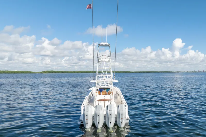 Yacht Photos Pics 2024 SeaVee 400Z boat with multiple engines on open water under blue sky.