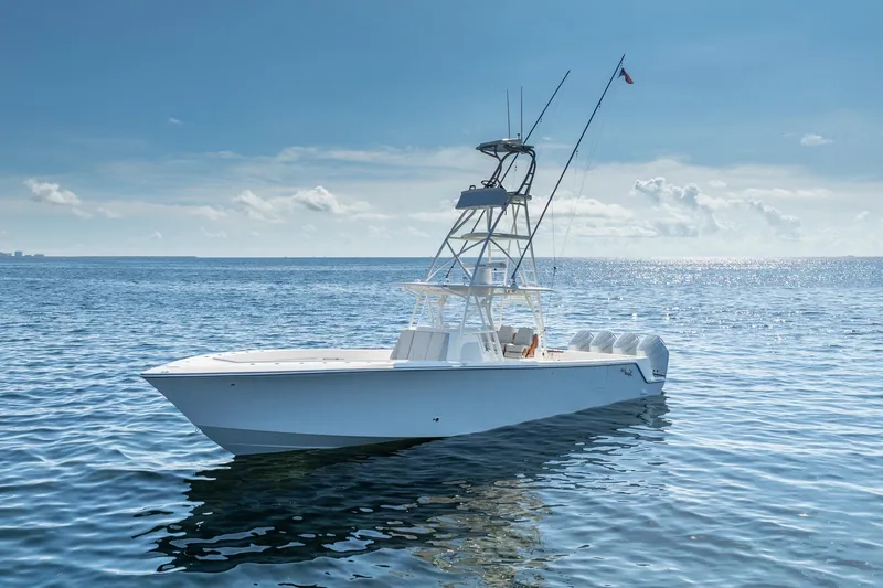 Yacht Photos Pics 2024 SeaVee 400Z boat on calm ocean under clear blue sky.