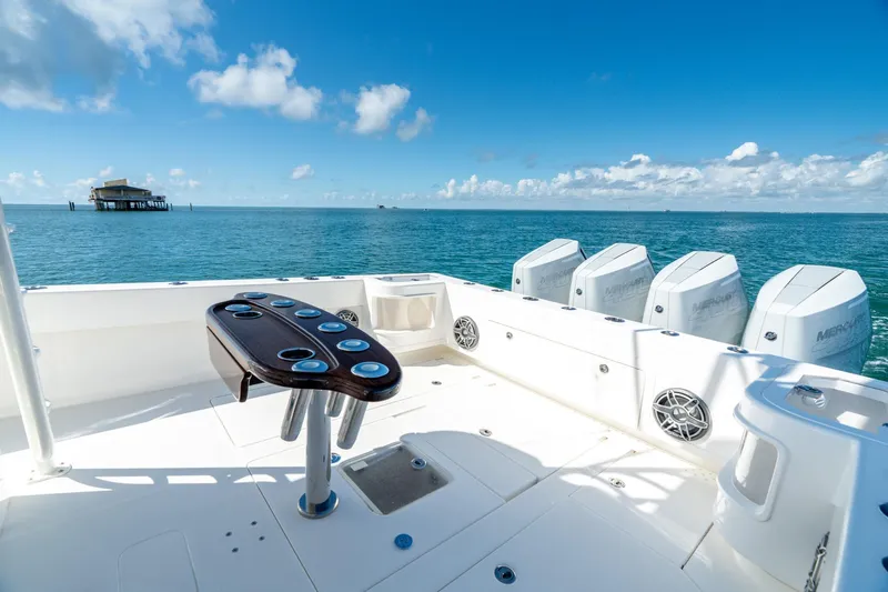  Yacht Photos Pics 2024 SeaVee 400Z boat with multiple engines, ocean view, and fishing setup.