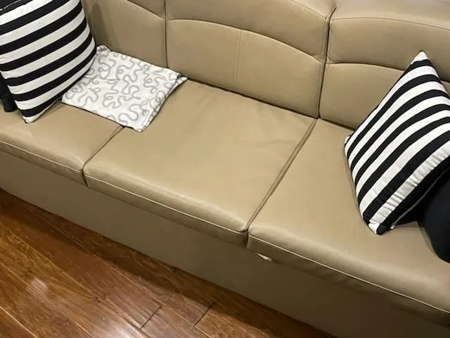  Yacht Photos Pics Beige leather seating with striped pillows on a 2014 Rinker 360 Express Cruiser.