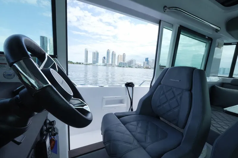  Yacht Photos Pics Interior of 2022 Axopar 37 XC Cross Cabin with city skyline view.