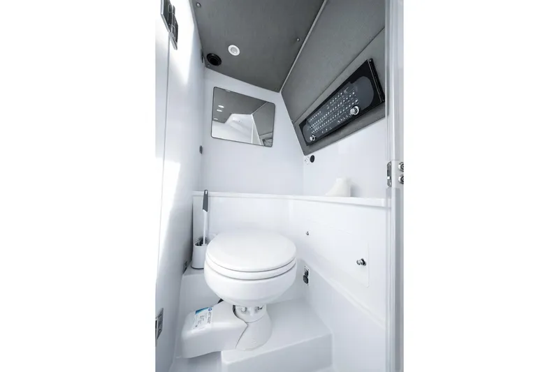  Yacht Photos Pics 2022 Axopar 37 XC Cross Cabin bathroom interior with modern fixtures and sleek design.