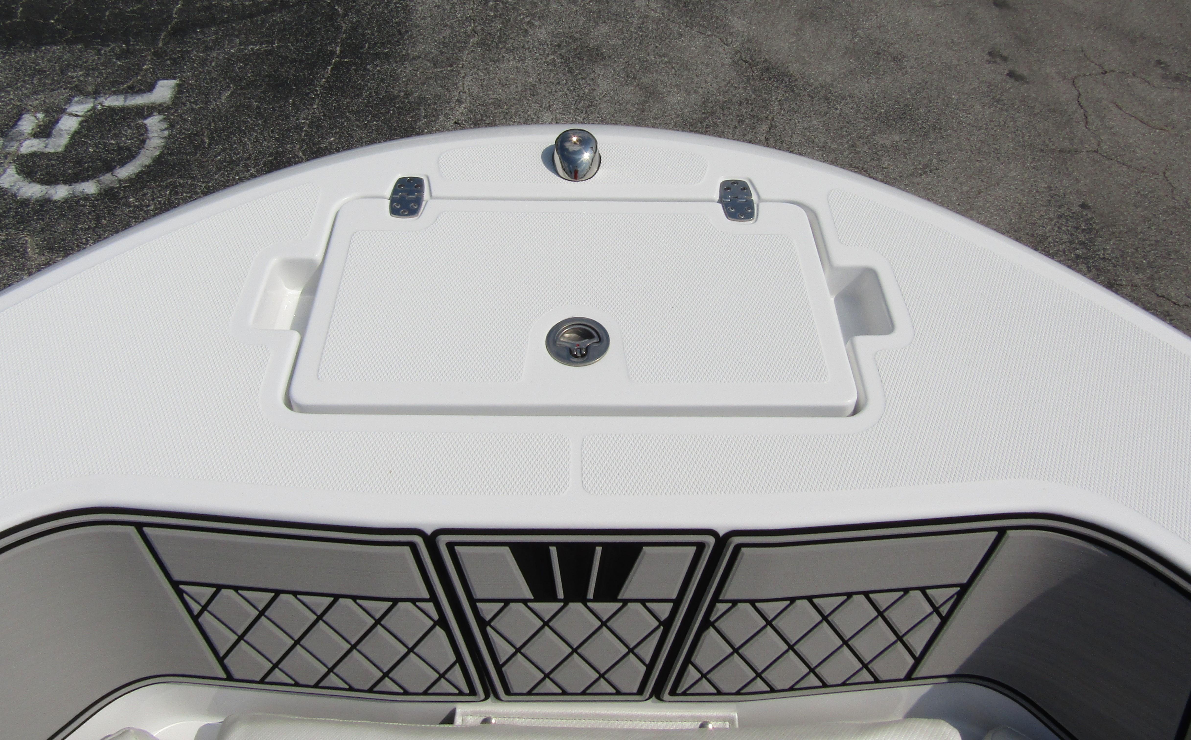 2024 Wellcraft 202 Fisherman boat deck with storage compartment and netted side panels.