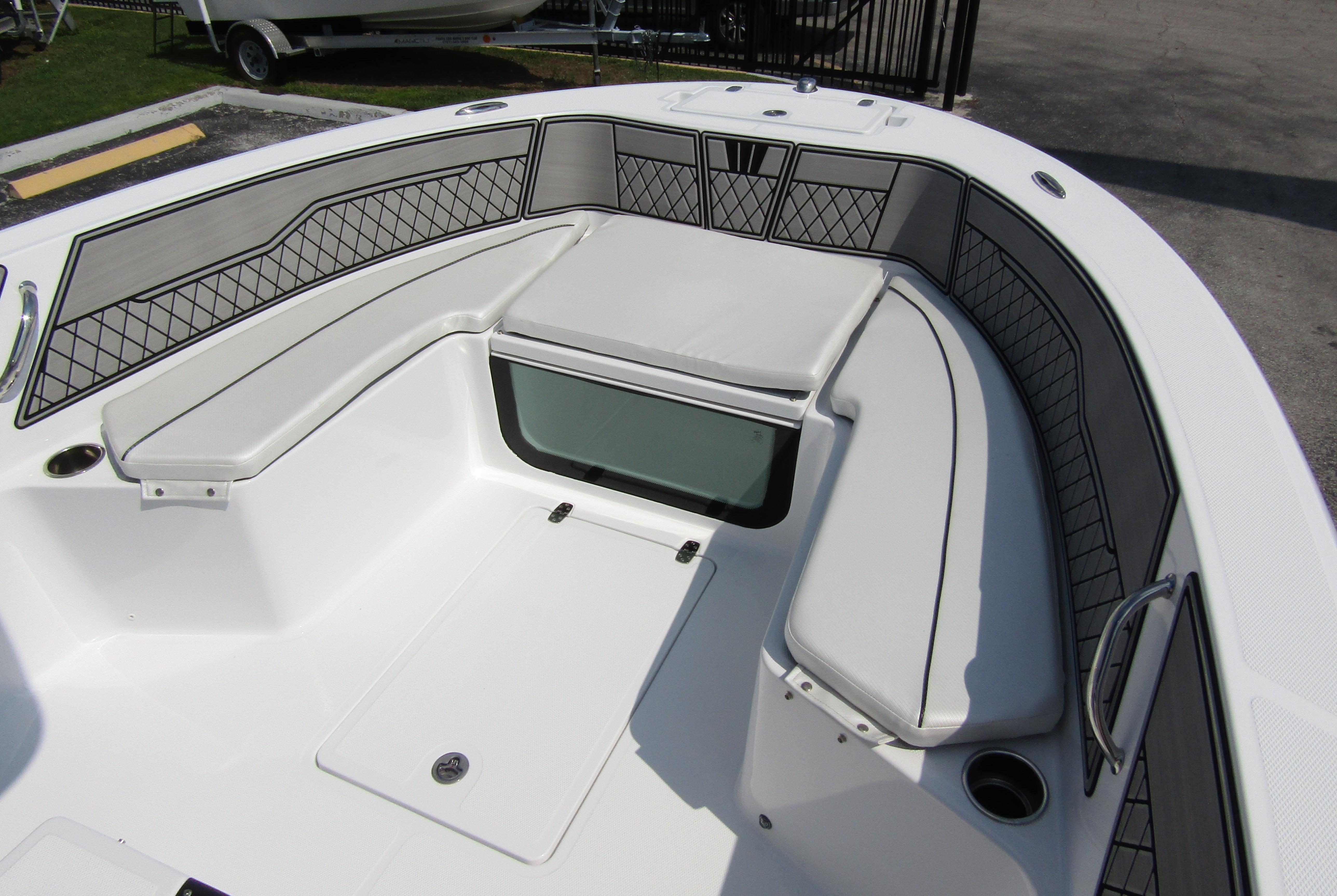 2024 Wellcraft 202 Fisherman boat interior with cushioned seating and storage compartments.