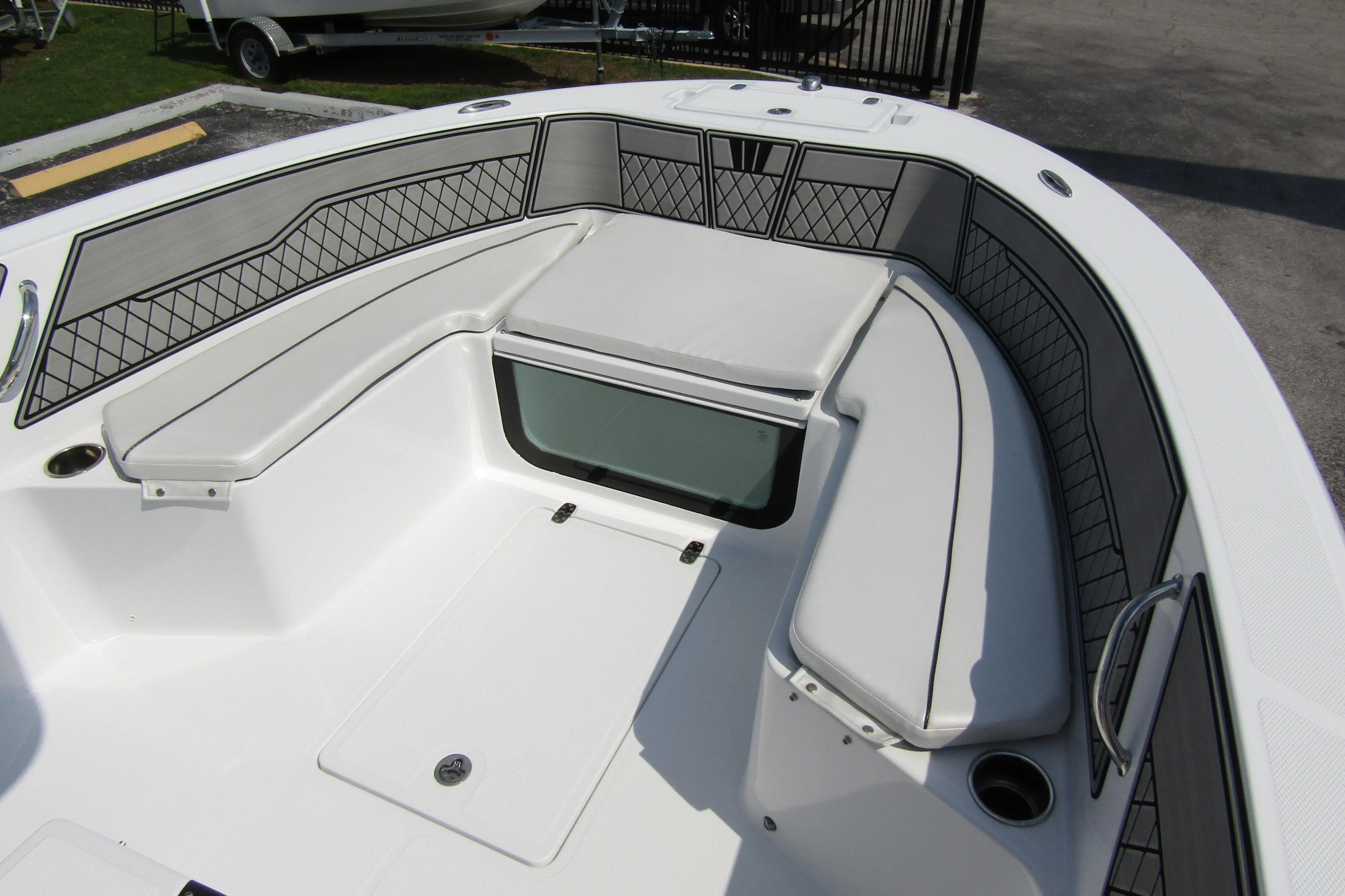 2024 Wellcraft 202 Fisherman boat interior with cushioned seating and storage compartments.