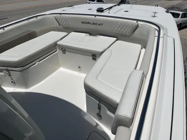  Yacht Photos Pics 2024 World Cat 260 CC-X boat interior with white cushioned seating and storage compartments.