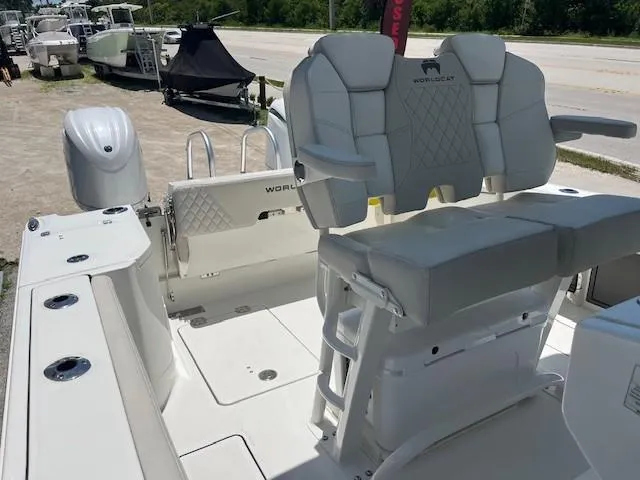  Yacht Photos Pics 2024 World Cat 260 CC-X boat interior with white seating and dual outboard motors.