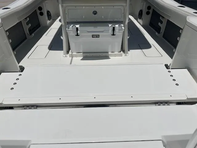  Yacht Photos Pics 2024 World Cat 260 CC-X boat deck with Yeti cooler, spacious seating, and storage compartments.