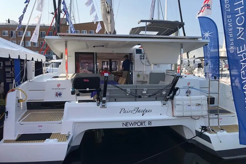 Paire De Jacques Yacht Photos Pics 2021 Fountaine Pajot Isla 40 catamaran docked at a marina, Newport, RI.