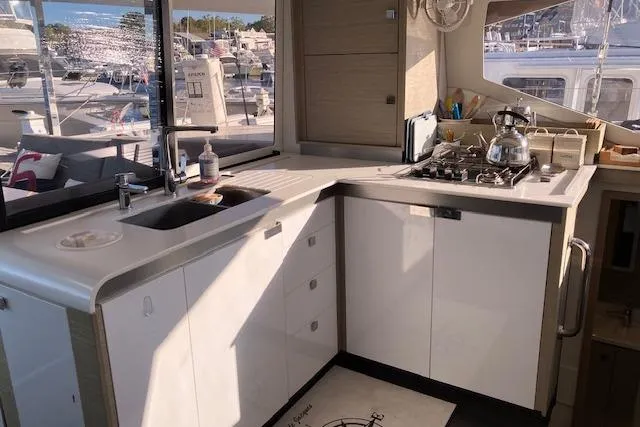 Paire De Jacques Yacht Photos Pics Modern kitchen in 2021 Fountaine Pajot Isla 40 catamaran with stove and sink.