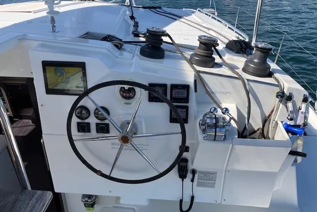 Paire De Jacques Yacht Photos Pics Helm of 2021 Fountaine Pajot Isla 40 catamaran with navigation instruments and steering wheel.