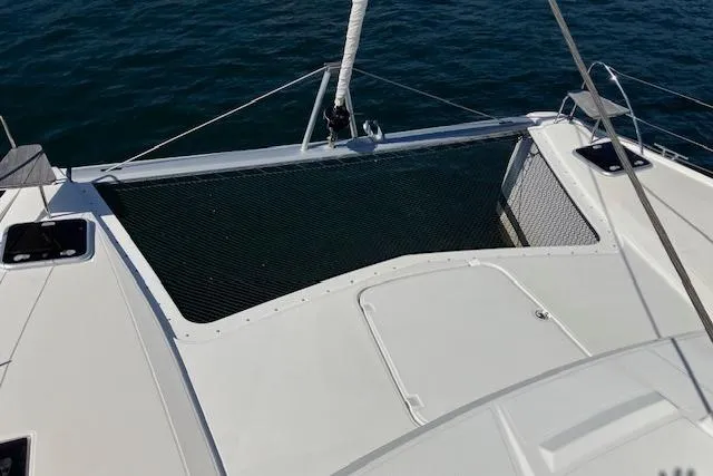 Paire De Jacques Yacht Photos Pics Fountaine Pajot Isla 40 catamaran deck, 2021 model, with netting over water.