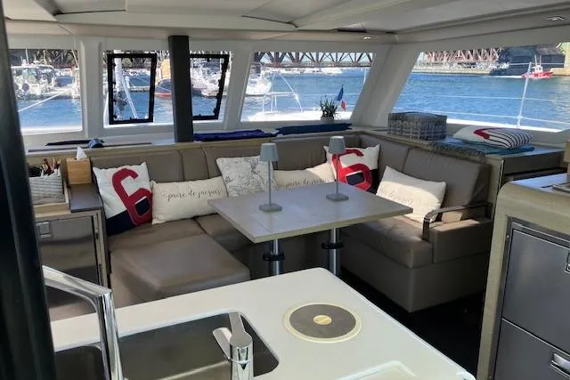 Paire De Jacques Yacht Photos Pics Luxurious interior of 2021 Fountaine Pajot Isla 40 catamaran with waterfront view.