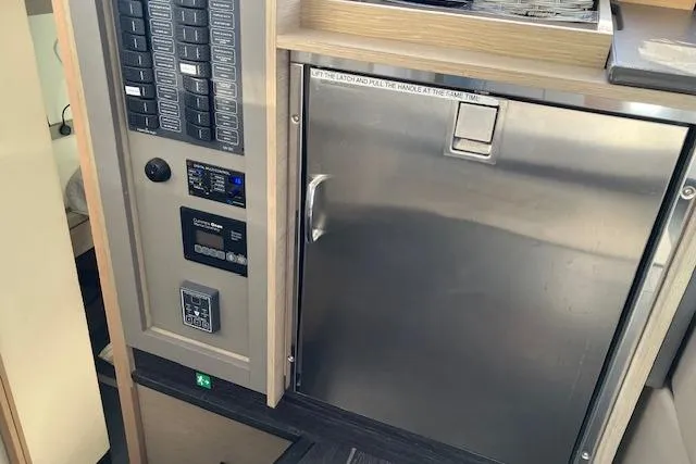 Paire De Jacques Yacht Photos Pics Control panel and stainless steel fridge in 2021 Fountaine Pajot Isla 40 yacht interior.