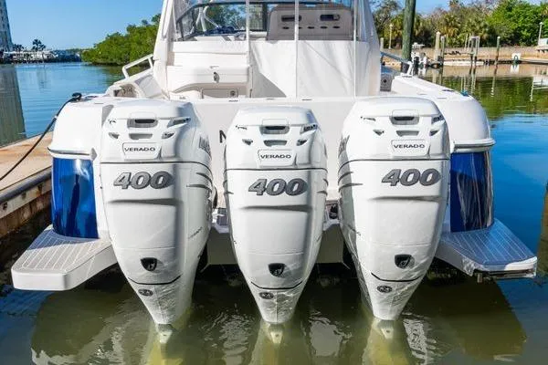  Yacht Photos Pics 2023 Intrepid 438 Evolution with triple 400 Verado engines docked at marina.