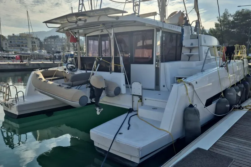  Yacht Photos Pics 2017 Bali 4.3 catamaran docked at marina with inflatable dinghy attached.