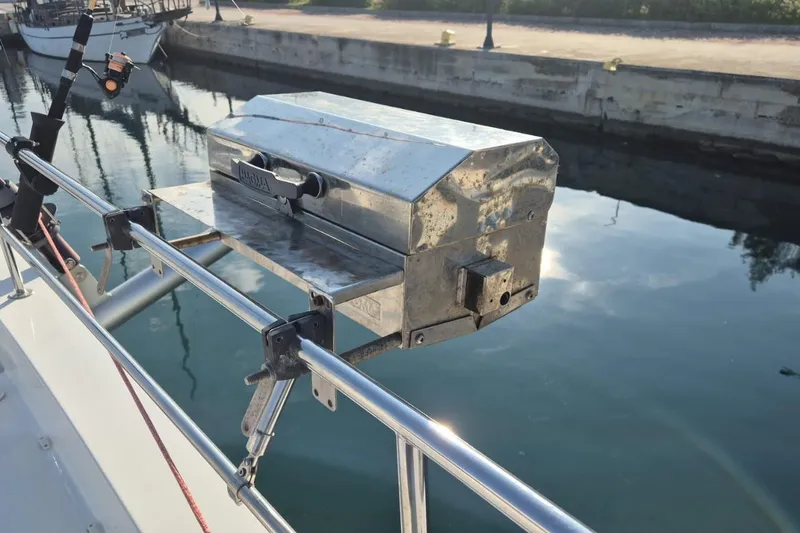  Yacht Photos Pics Boat-mounted grill on a 2017 Bali 4.3 catamaran, docked by calm waters.