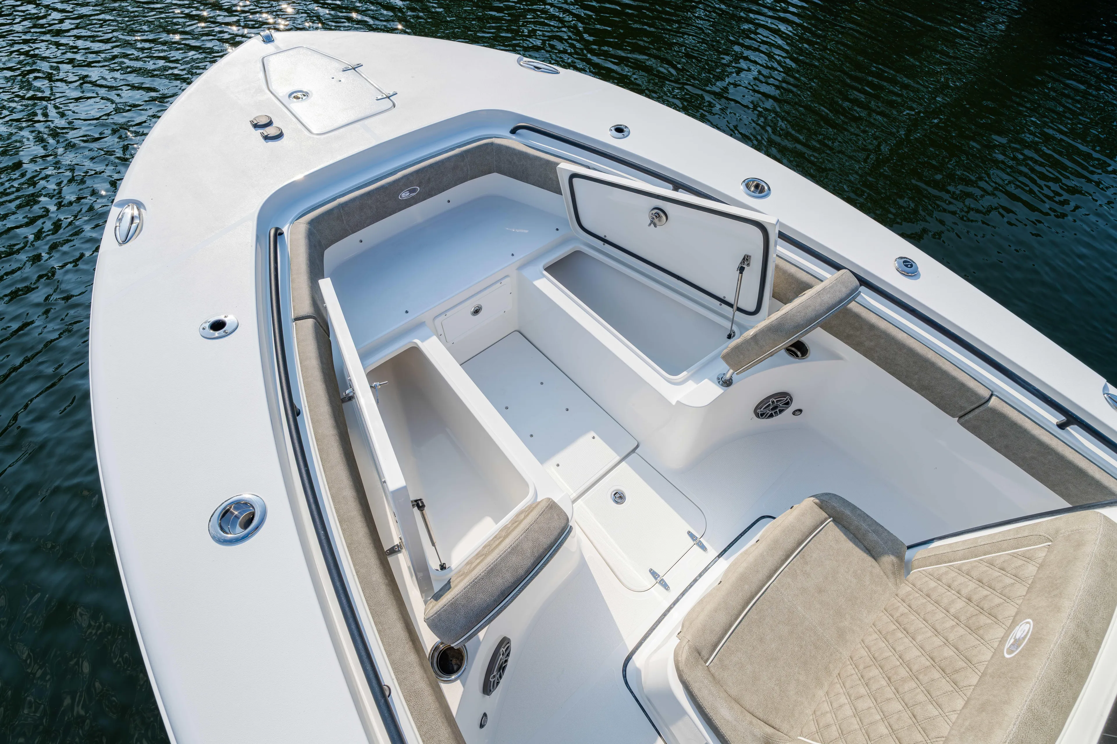  Yacht Photos Pics 2026 Sea Hunt Gamefish 25 boat interior with open storage compartments and cushioned seating.