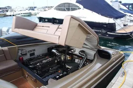  Yacht Photos Pics Nor-Tech 52 boat engine compartment open at dock, showcasing powerful engine, 2010 model.