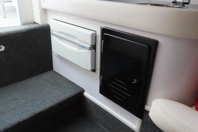  Yacht Photos Pics 2007 Donzi 35 ZR interior with storage compartments and carpeted steps.