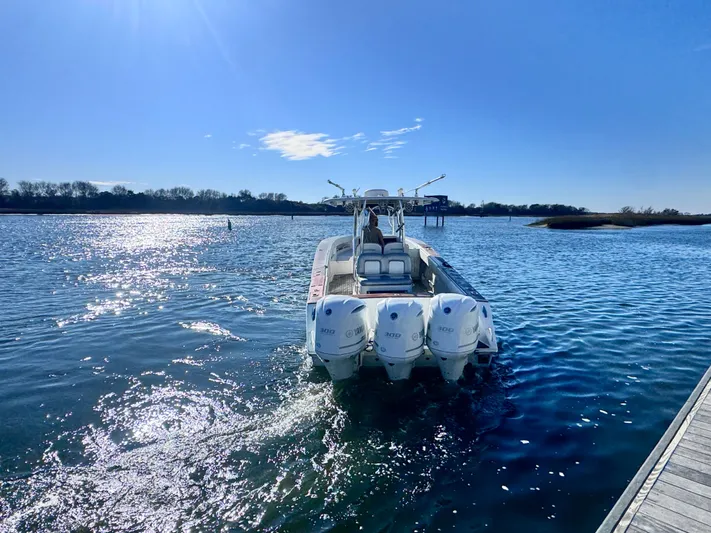  Yacht Photos Pics Jupiter 38 HFS 2015 boat on sunny waters.