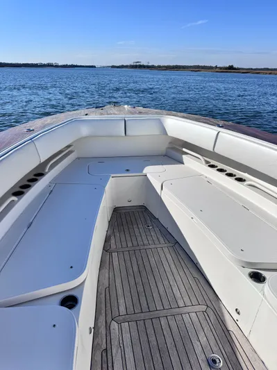  Yacht Photos Pics Jupiter 38 HFS 2015 boat with spacious deck on calm waters.