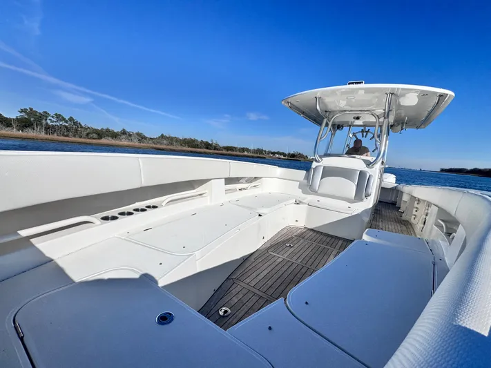  Yacht Photos Pics 2015 Jupiter 38 HFS boat on calm water under blue sky.