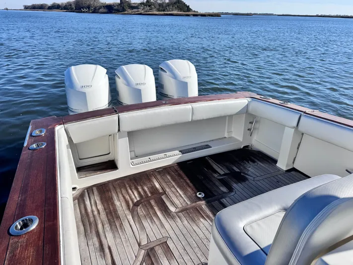  Yacht Photos Pics Jupiter 38 HFS 2015 with triple outboard engines on calm water.