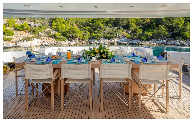 Zaliv III Yacht Photos Pics Luxurious dining setup on 2011 Mondomarine Semi Displacement yacht, surrounded by scenic waters.