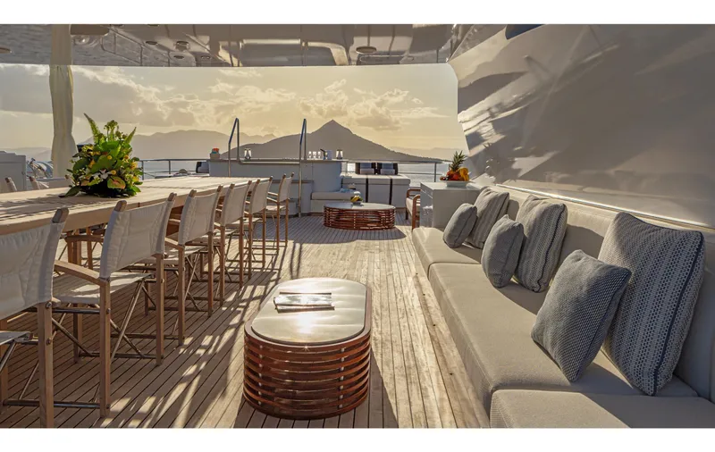 Zaliv III Yacht Photos Pics Luxurious Mondomarine yacht deck with elegant seating, bar stools, and scenic ocean view.