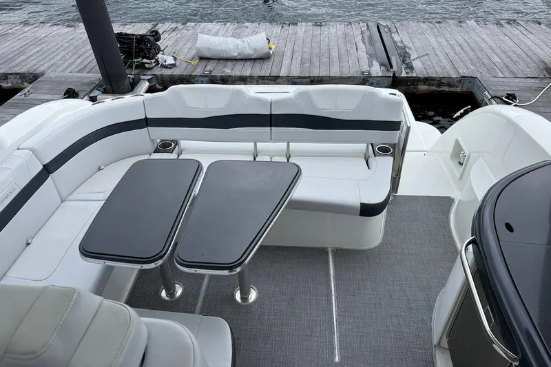  Yacht Photos Pics 2019 Formula 37 Performance Cruiser interior with seating and tables by the dock.