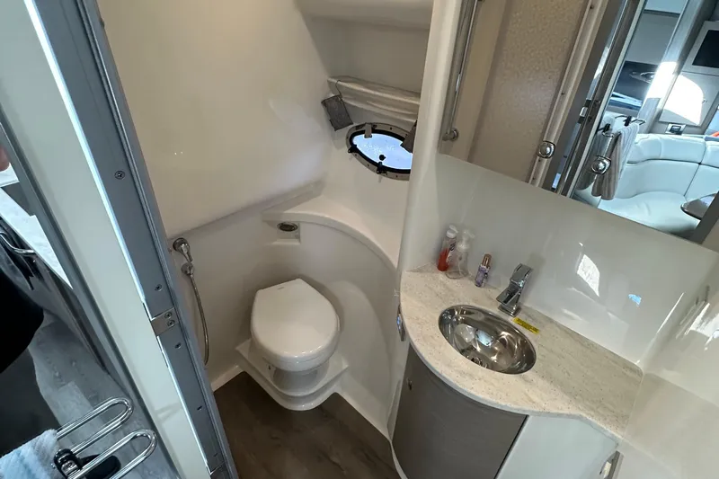  Yacht Photos Pics 2019 Formula 37 Performance Cruiser bathroom with toilet, sink, and mirror.