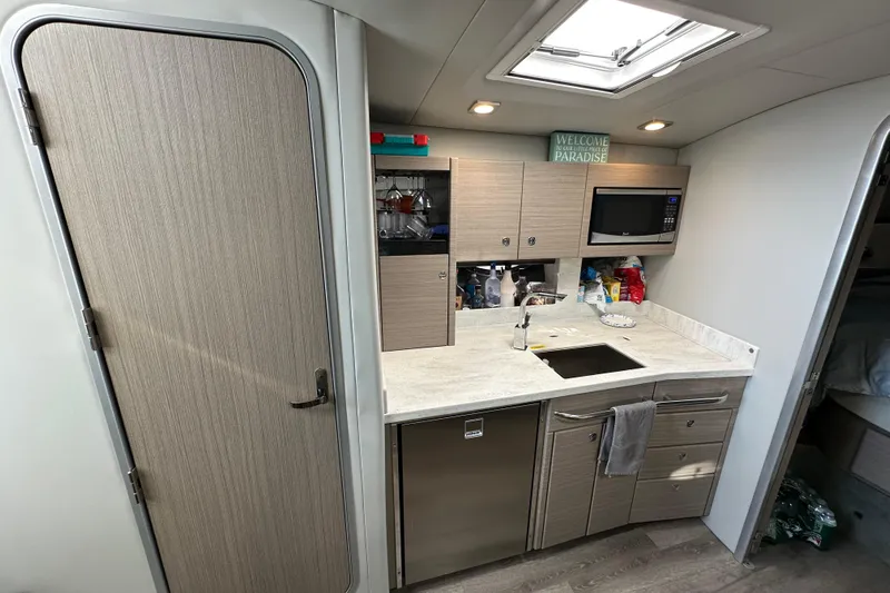  Yacht Photos Pics 2019 Formula 37 Performance Cruiser interior kitchen with modern amenities and sleek design.
