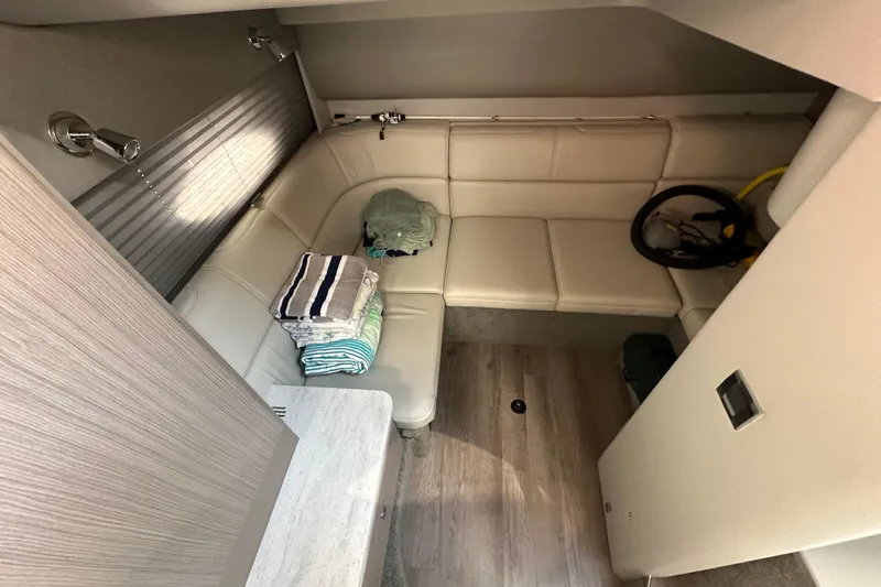  Yacht Photos Pics 2019 Formula 37 Performance Cruiser interior with beige seating and folded towels.