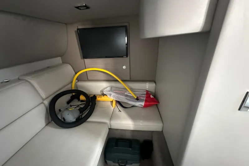  Yacht Photos Pics Interior of 2019 Formula 37 Performance Cruiser with TV and equipment on white seating.