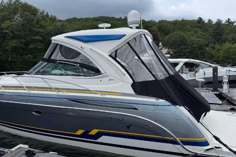  Yacht Photos Pics 2019 Formula 37 Performance Cruiser docked, featuring sleek design and vibrant accents.